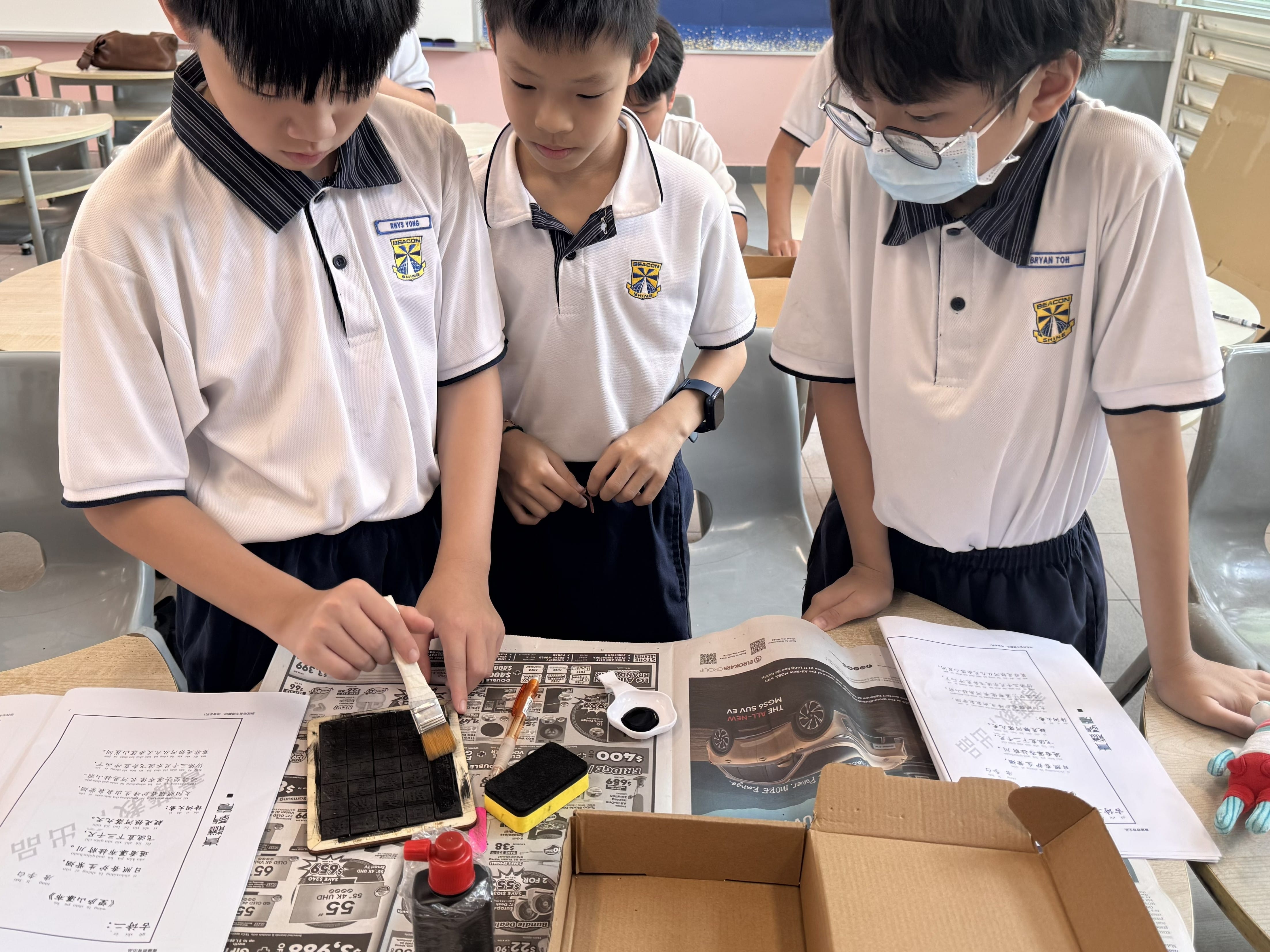 P5 CL Students experiencing the ancient art of Chinese movable type printing through an interactive hands-on activity.